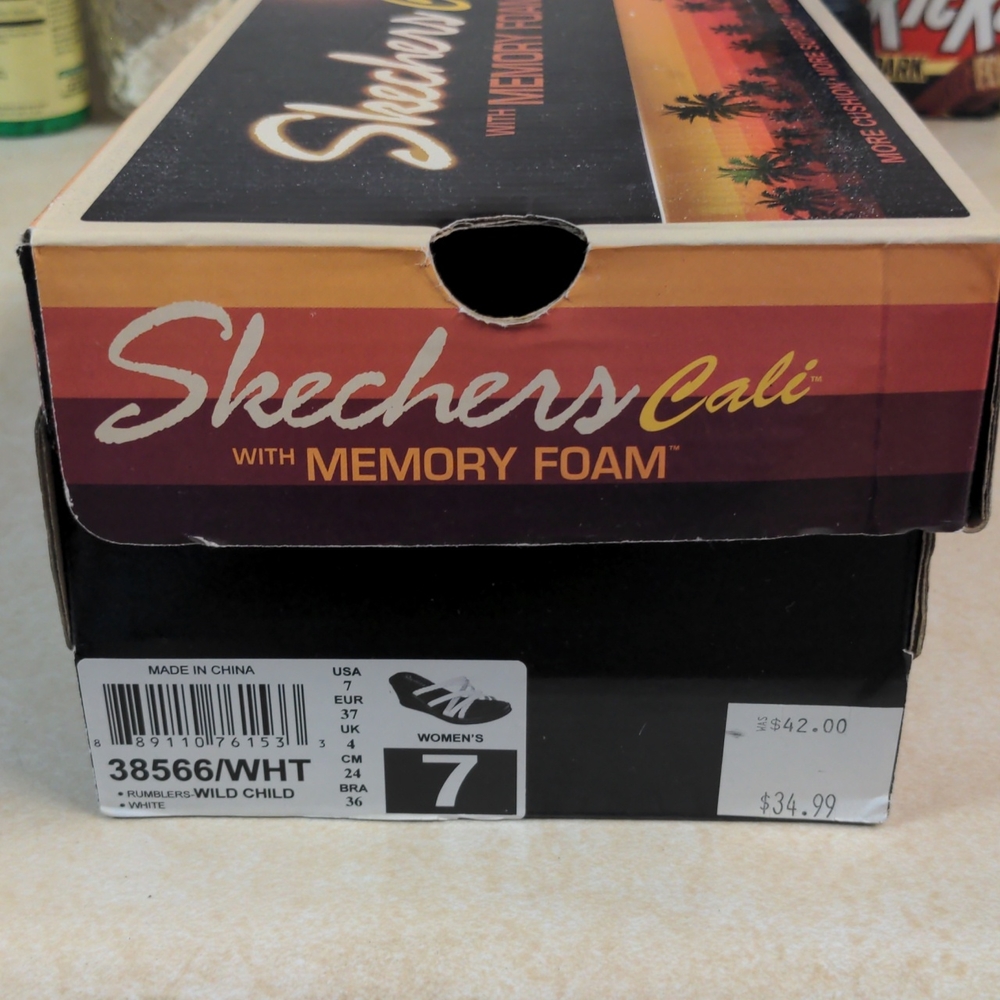 White Sketchers sandals